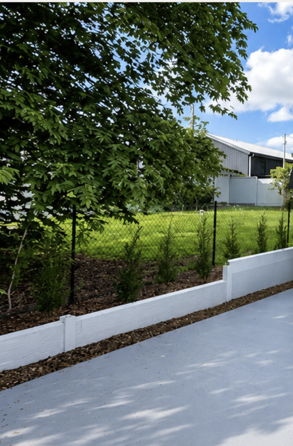 White concrete sleeper retaining wall beside a new driveway, Stonebuilt Projects, Brisbane South