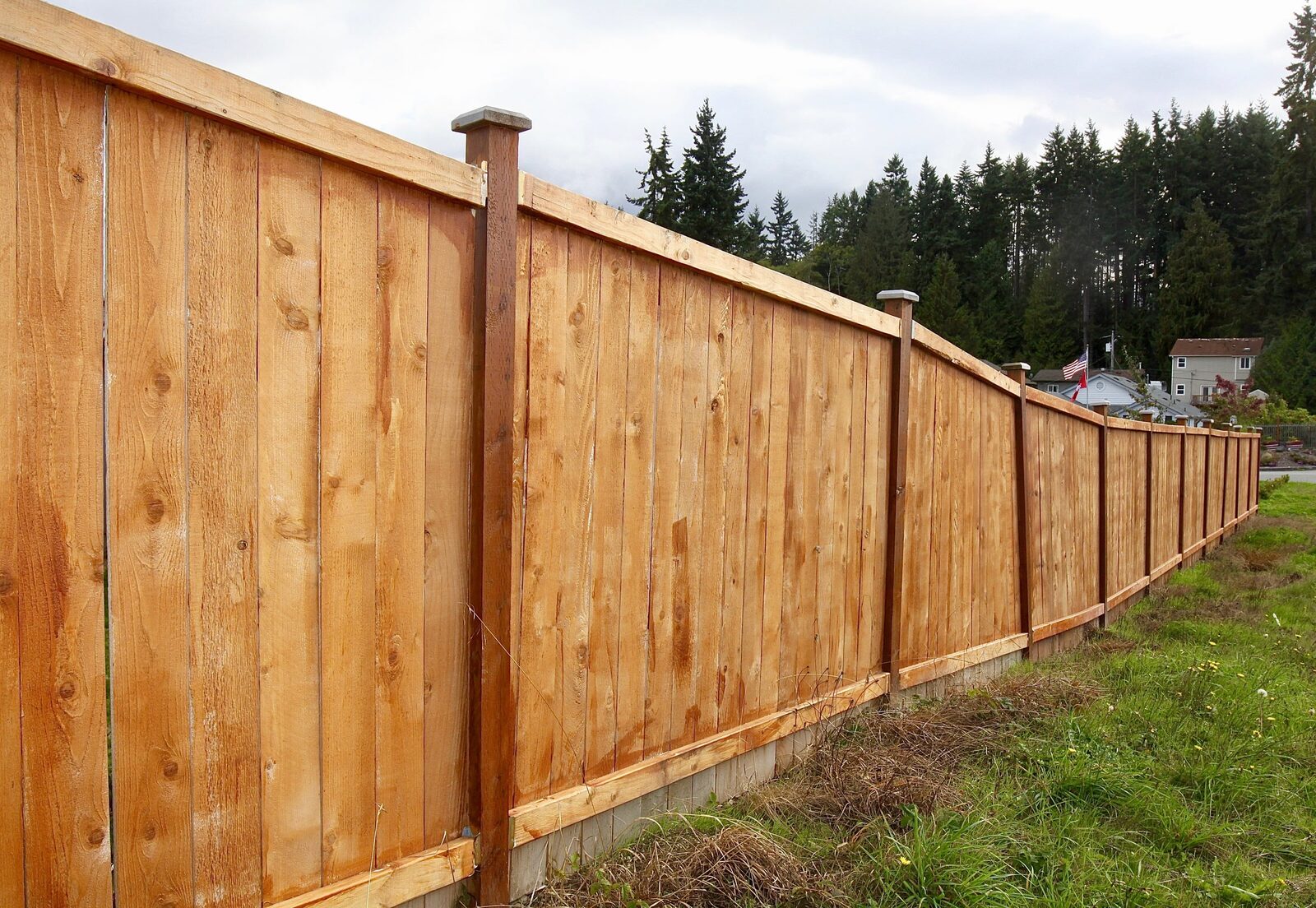 Timber paling boundary fence on a sloping block, Stonebuilt fencing project